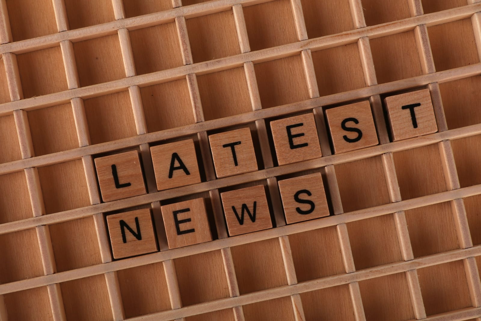 wooden blocks with letters spelling out Latest News